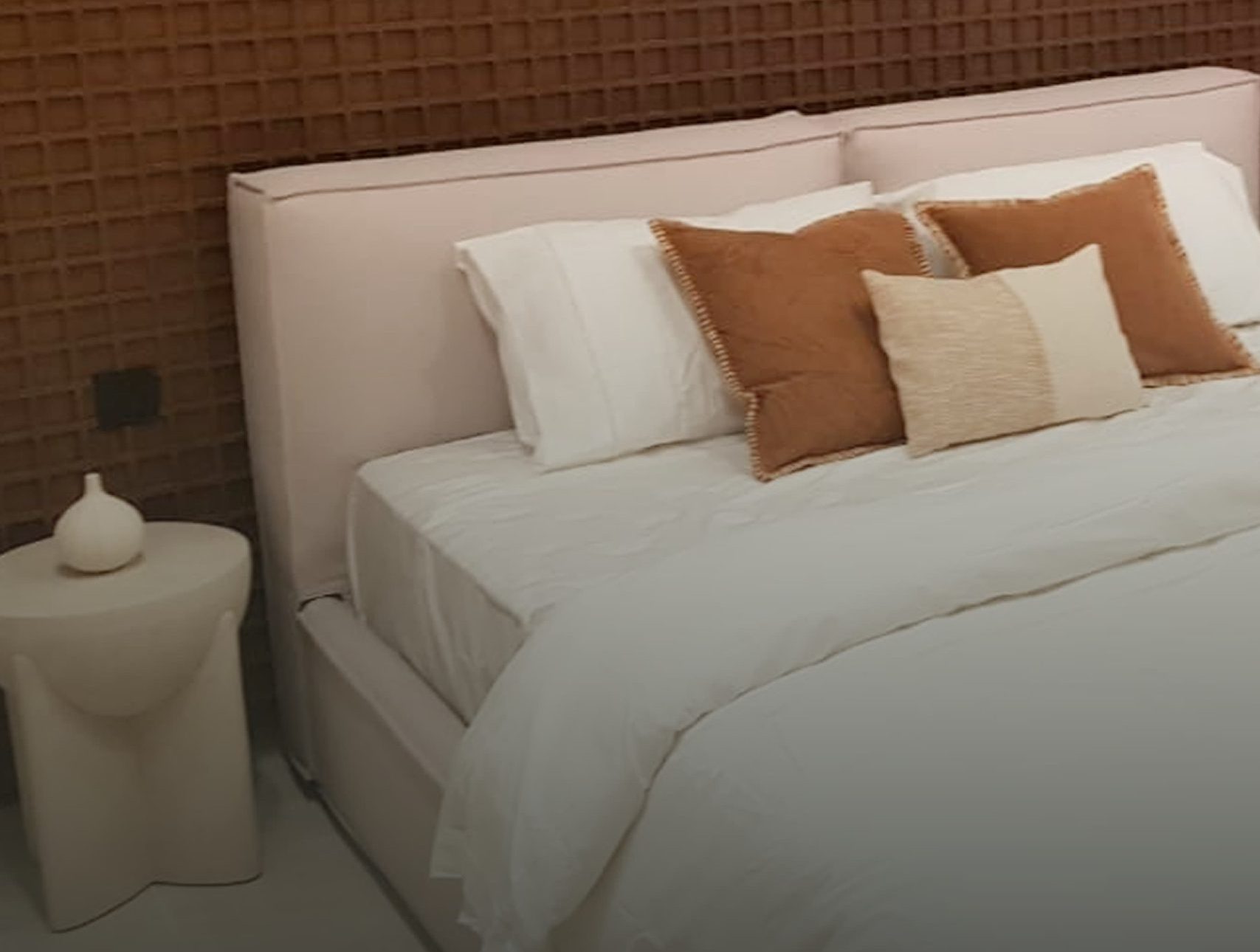 Luxury residential bedroom interior with textured headboard by Southern Interior & Fitout LLC